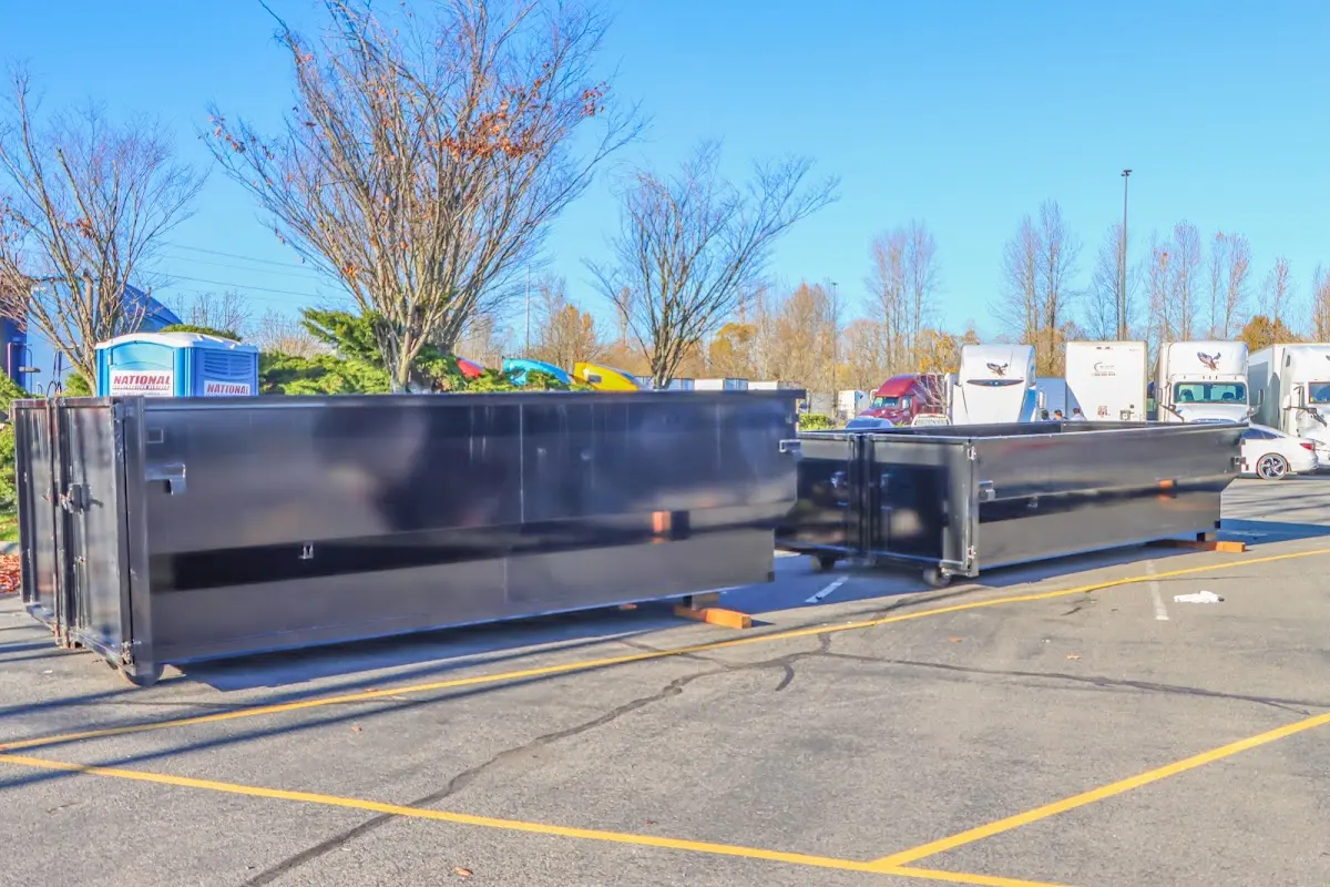 Professional dumpster rental service with roll-off container on residential driveway in North Oaks